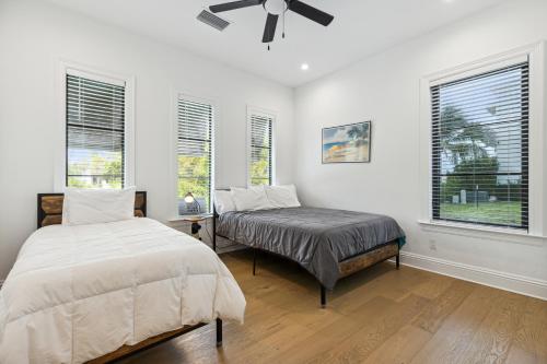a bedroom with two beds and a ceiling fan at 119 Ocean Estates Dr in Lakewood Park