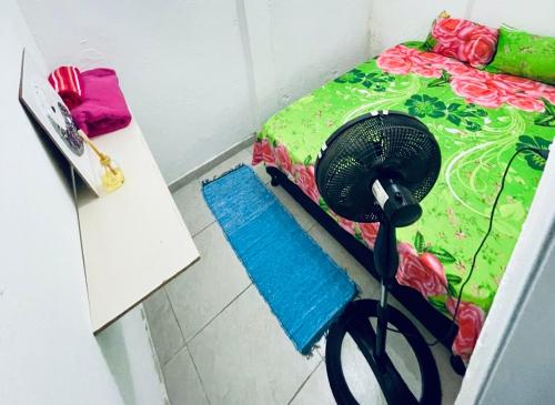 Ένα ή περισσότερα κρεβάτια σε δωμάτιο στο Kitnet Dream House 1