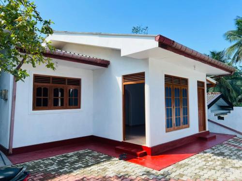 a rendering of a small house at Ranathunga Guest House in Ginimellagaha West