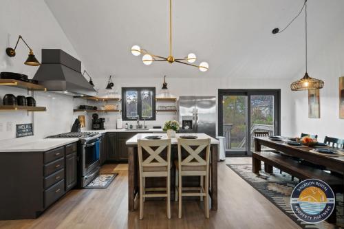 a kitchen with a table and some chairs in it at Lake Geneva Family House Pool Table Fireplace and Sleeps 10 in Lake Como
