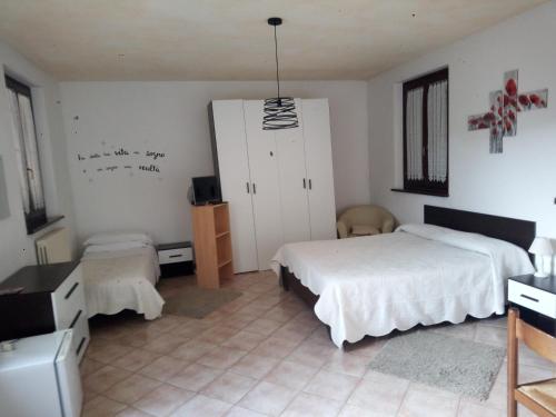 Ένα ή περισσότερα κρεβάτια σε δωμάτιο στο Affittacamere Flli Rossi