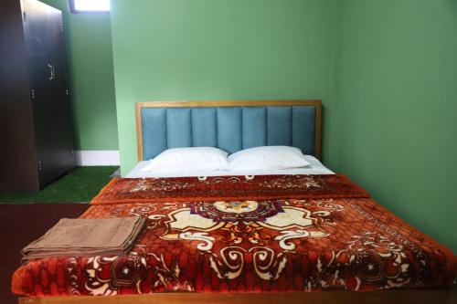 Ένα ή περισσότερα κρεβάτια σε δωμάτιο στο The kamcha Homestay