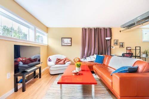 a living room with a couch and a table at Fresh Space Quiet Air Studio in Mercer Island