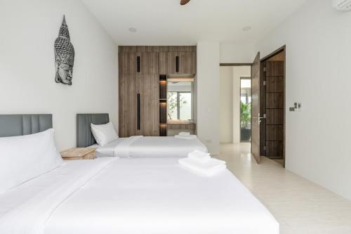 Postel nebo postele na pokoji v ubytování Villa Coconut Samui - The Heart of Island Serenity