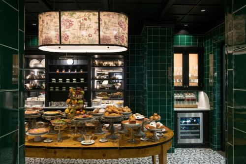 a bakery with a table with food on it at Helvetia&Bristol Firenze – Starhotels Collezione in Florence