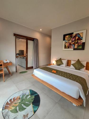 a bedroom with a large bed in a room at Casagana by Gana Management Canggu in Dalung