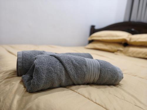 Ένα ή περισσότερα κρεβάτια σε δωμάτιο στο AF Barokah Homestay Unit 1, Kuala Terengganu