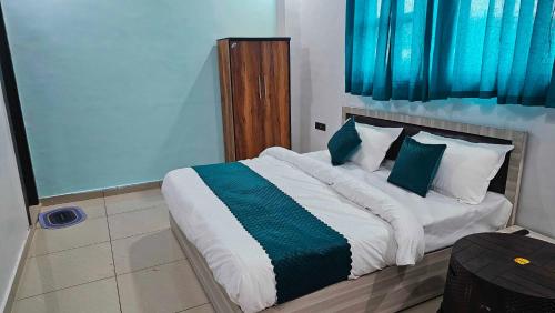 Postel nebo postele na pokoji v ubytování Hotel O Sukoon Guest House