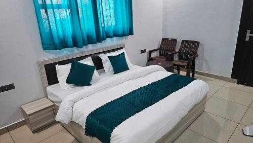 Postel nebo postele na pokoji v ubytování Hotel O Sukoon Guest House