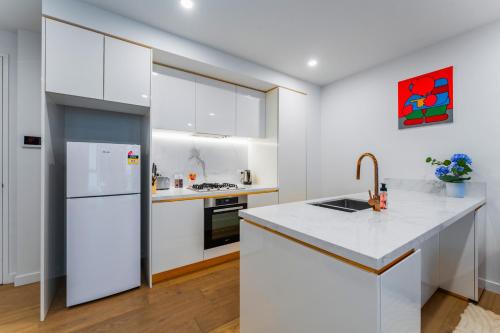 Η κουζίνα ή μικρή κουζίνα στο Art filled 2b2b Apt Family Friendly Free Parking