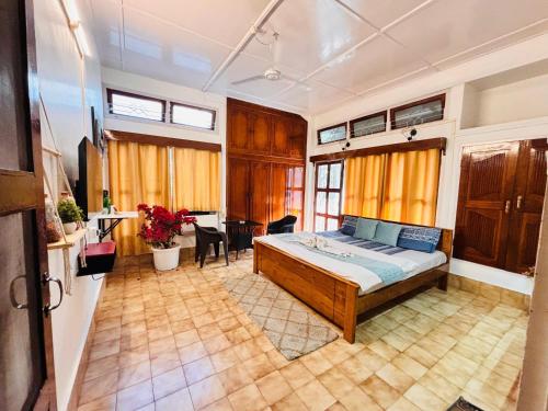 a bedroom with a large bed in a room at Collection O Arya Vidyapeeth College Guwahati in Guwahati