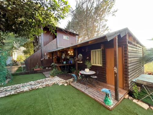 a small house with a patio and a yard at Relax Home Nazareth Rawaqan 2026 منتجع روقان צמר נצרת in Nazareth