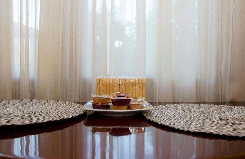 a plate of food on a table with a chair at Nefeli in Levidhion