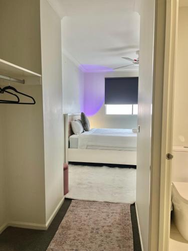 a small bedroom with a bed with a purple ceiling at Mahzan on Kilcunda - Ensuite 4 in Truganina