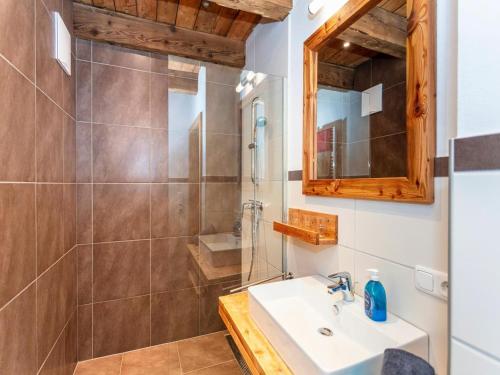 a bathroom with a sink and a shower at Apartment Wiesbachhorn Zell am See-Kaprun in Kitzsteinhorn
