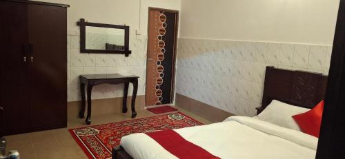 Un pat sau paturi într-o cameră la Rose Inn