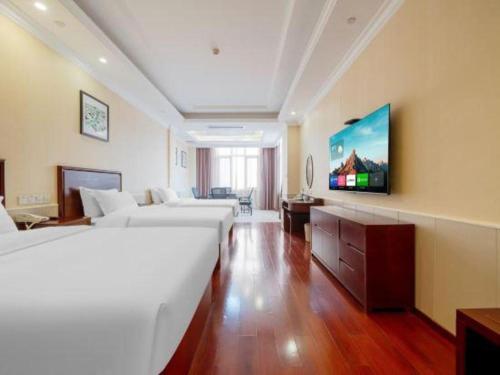 Postel nebo postele na pokoji v ubytování GreenTree Inn Suzhou Dongxing Road Xinye Square Express Hotel