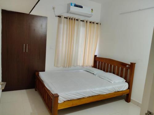 Voodi või voodid majutusasutuse Home Stay in Puzhal toas
