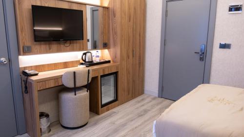 Postel nebo postele na pokoji v ubytování Optimal Hotel