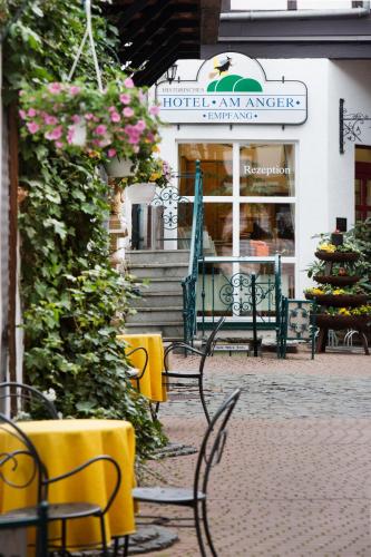 a group of chairs sitting in front of a building at Am Anger in Wernigerode