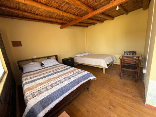 Ένα ή περισσότερα κρεβάτια σε δωμάτιο στο Alojamiento privado en casa de playa