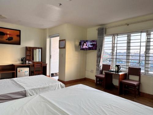 TV a/nebo společenská místnost v ubytování Oriio Hotel Cát Bà