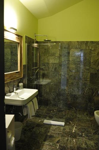 a bathroom with a sink and a shower at Palazzo del Senatore in Atina