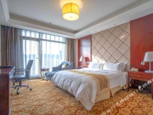 Postel nebo postele na pokoji v ubytování Jiangsu Cuipingshan Hotel