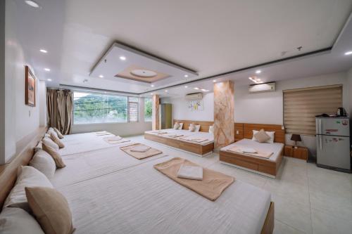 Ένα ή περισσότερα κρεβάτια σε δωμάτιο στο Seoul Motel