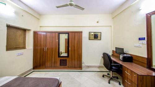 an office with a wooden door and a desk at PeaceWood in kolkata