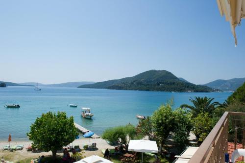a view of a beach with boats in the water at Akrogiali Studios in Nydri