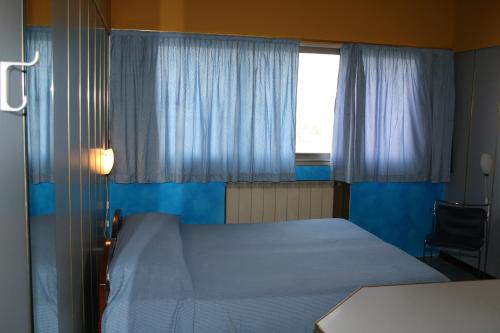 Un ou plusieurs lits dans un hébergement de l'établissement Hotel Maria