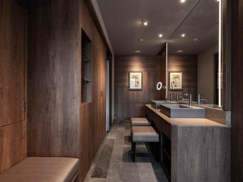 a bathroom with a sink and two mirrors at Y-HOTEL - Vacation STAY 22285v in Hiroshima