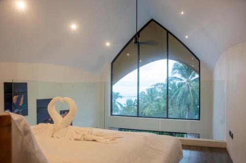 Giường trong phòng chung tại Villa Sawasdee Sea