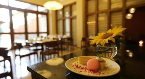 a plate of food on a table in a restaurant at The Pema by Realm in Thimphu