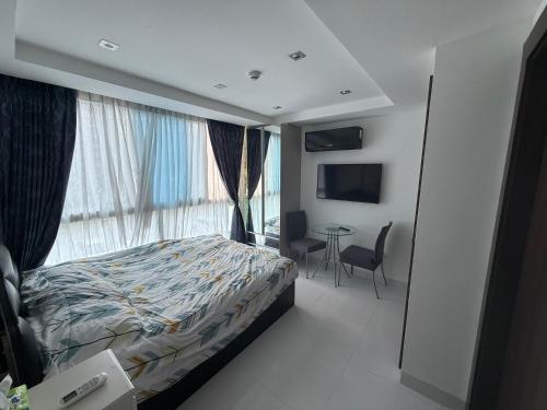 Voodi või voodid majutusasutuse SERENITY Wongamant CONDO toas