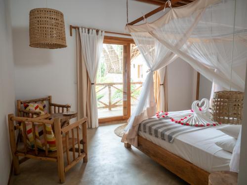 Postel nebo postele na pokoji v ubytování Boutique Villa Unaweza
