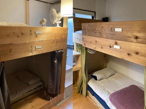 a room with two bunk beds and a bed at Hostel Blue Door ホステル ブルードア in Nagoya