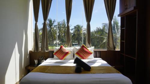 Ένα ή περισσότερα κρεβάτια σε δωμάτιο στο AT CKM Homestay