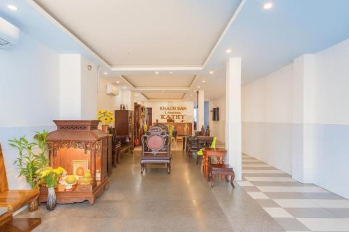 a hallway with chairs and tables in a building at Kathy Hotel in Ho Chi Minh City
