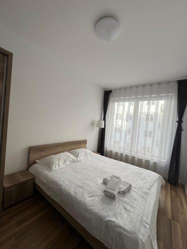 Ένα ή περισσότερα κρεβάτια σε δωμάτιο στο Sunflower Apartments