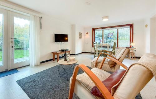 a living room with a couch and a table at 1 Bedroom Nice Apartment In De Panne in De Panne