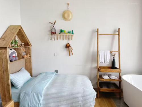 Postel nebo postele na pokoji v ubytování Fuxian Lake Lanshan Su Ant Nest Homestay