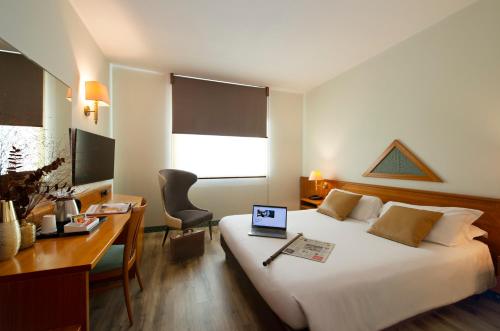 Postel nebo postele na pokoji v ubytování Castagna Palace Hotel & Restaurant