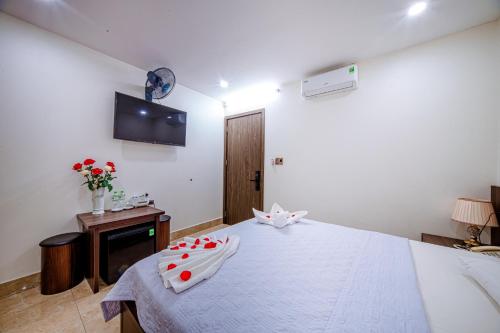 Postel nebo postele na pokoji v ubytování Thu Ha Hotel