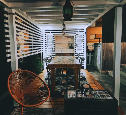 a room with a table and chairs on a porch at AlCivico3 in Civitanova Marche