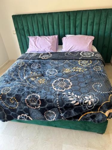 Giường trong phòng chung tại Les belles loges