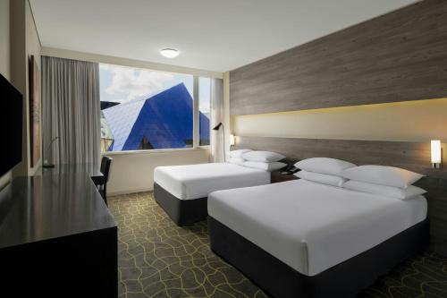a hotel room with two beds and a window at Four Points by Sheraton Perth in Perth