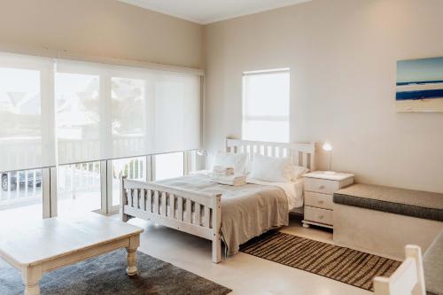 Ένα ή περισσότερα κρεβάτια σε δωμάτιο στο Lilla's Landing