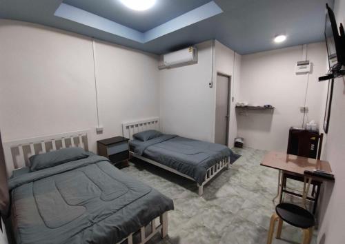 Photo de la galerie de l'établissement แกนล่อน เฮ้าส์, à Ban Rai Khlong Sai